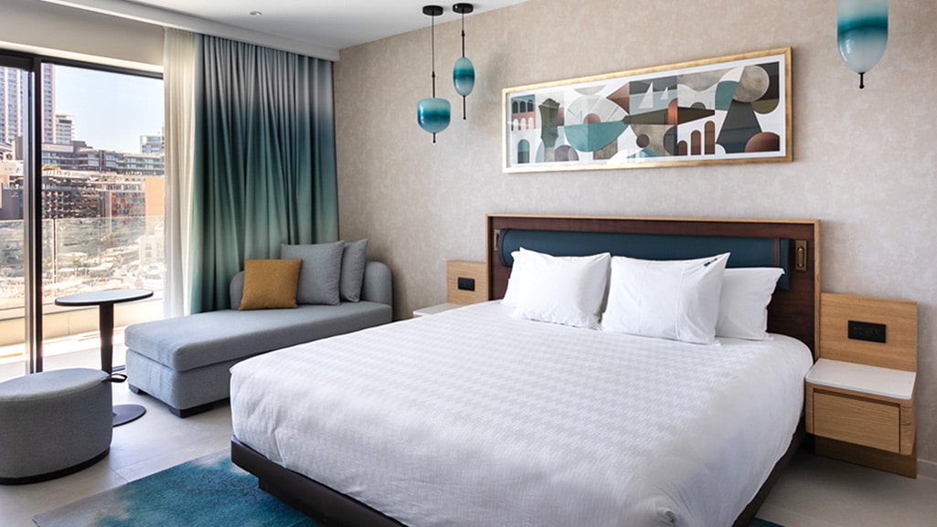 Guest suite at Hard Rock Hotel Malta featuring bespoke furniture and joinery manufactured by Construct Furniture.
