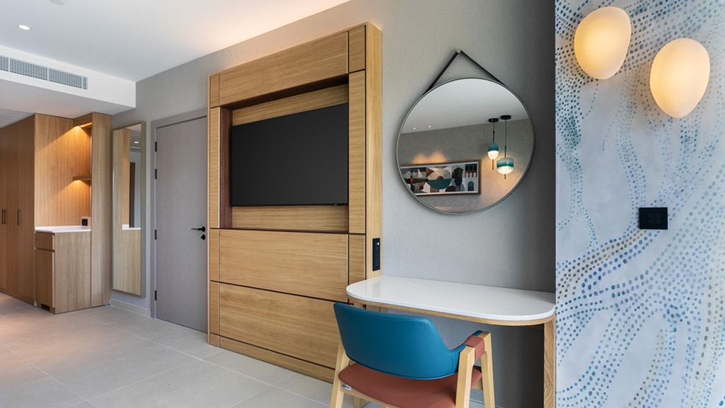 Custom-built furniture, wardrobe and vanity area within a Hard Rock Hotel Malta guest suite by Construct Furniture.